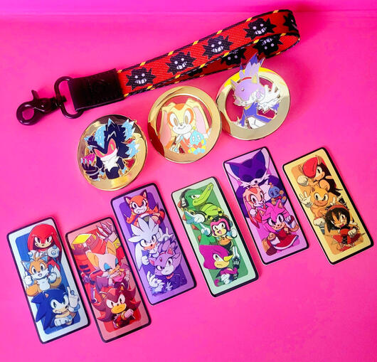 Wrist lanyard, pins, &amp; stickers